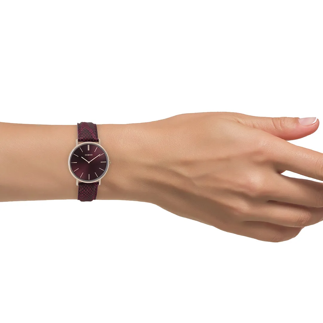 Rose gold coloured  watch with burgundy leather strap